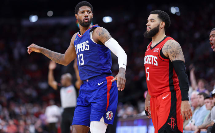 Clippers forward Paul George (13) reacts after making a basket as Houston Rockets guard Fred VanVleet (5) looks on during the fourth quarter at Toyota Center.